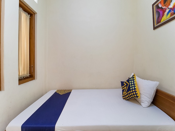 Imagen de la habitación del Hotel OYO 1982 Golf Papa Costel. Foto 14