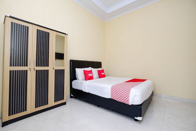 Imagen de la habitación del Hotel OYO 2058 Griya Ria. Foto 2