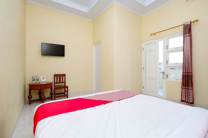 Imagen de la habitación del Hotel OYO 2058 Griya Ria. Foto 10