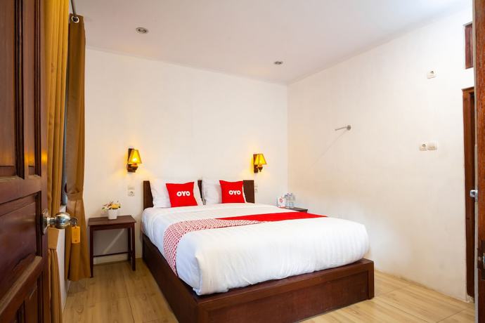 Imagen de la habitación del Hotel OYO 2068 Abhaya Mudra Homestay. Foto 3