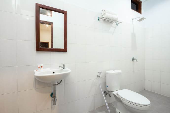 Imagen de la habitación del Hotel OYO 2068 Abhaya Mudra Homestay. Foto 7