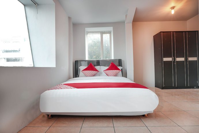 Imagen de la habitación del Hotel OYO 208 G house. Foto 6