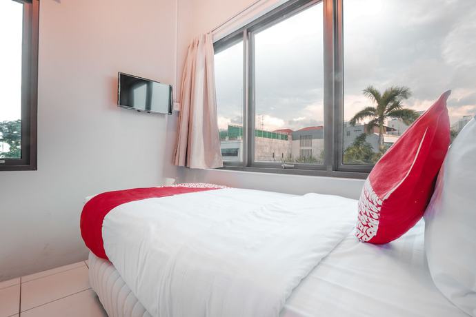 Imagen de la habitación del Hotel OYO 208 G house. Foto 10