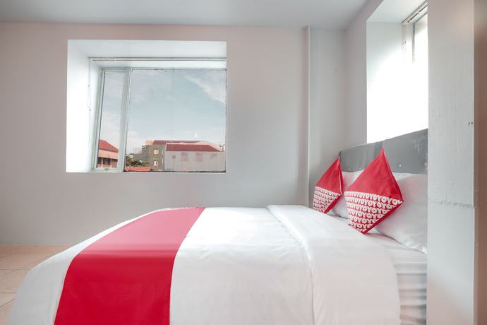 Imagen de la habitación del Hotel OYO 208 G house. Foto 12