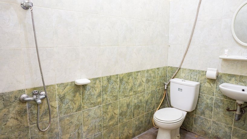 Imagen de la habitación del Hotel OYO 2085 Chrysanta. Foto 12
