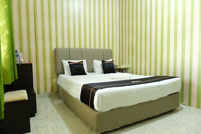 Imagen de la habitación del Hotel OYO 2186 Esbe Syariah. Foto 11