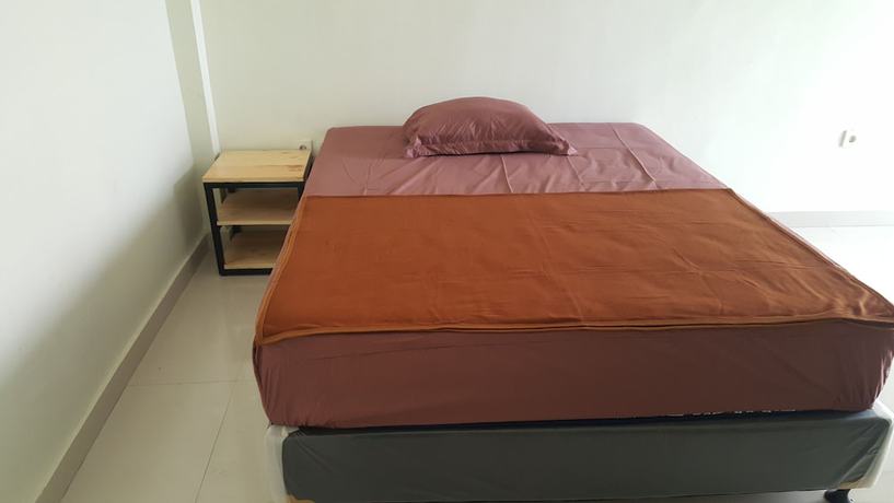 Imagen de la habitación del Hotel OYO 2203 Wira Residence. Foto 5