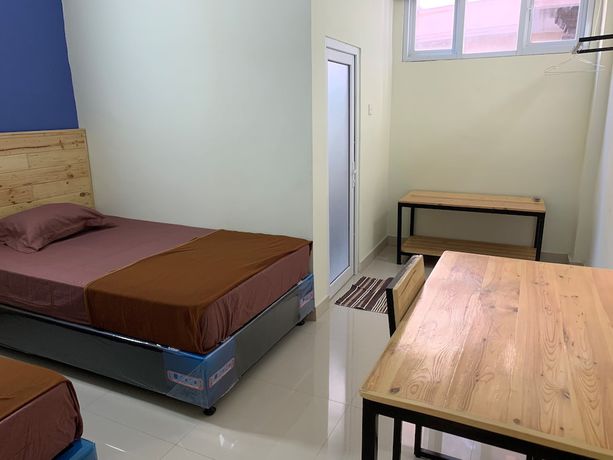 Imagen de la habitación del Hotel OYO 2203 Wira Residence. Foto 6
