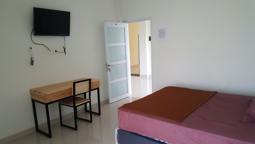 Imagen de la habitación del Hotel OYO 2203 Wira Residence. Foto 7