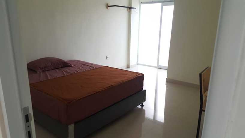 Imagen de la habitación del Hotel OYO 2203 Wira Residence. Foto 9