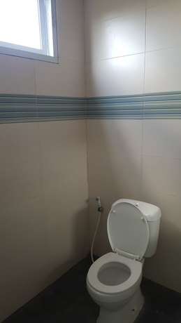 Imagen de la habitación del Hotel OYO 2203 Wira Residence. Foto 11