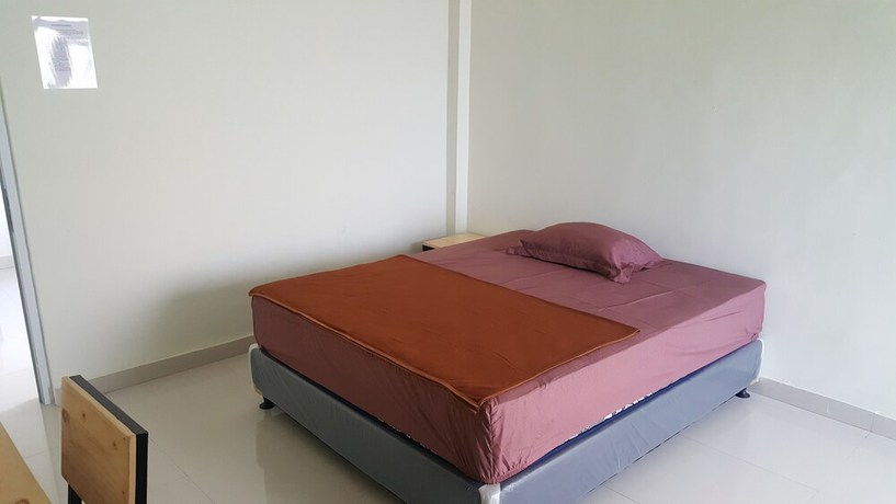 Imagen de la habitación del Hotel OYO 2203 Wira Residence. Foto 12