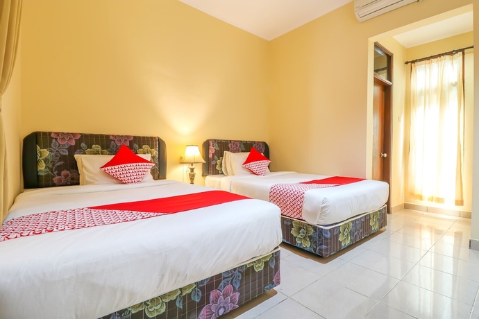 Imagen de la habitación del Hotel OYO 2280 Wisma Guntur II. Foto 2