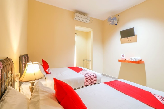 Imagen de la habitación del Hotel OYO 2280 Wisma Guntur II. Foto 5