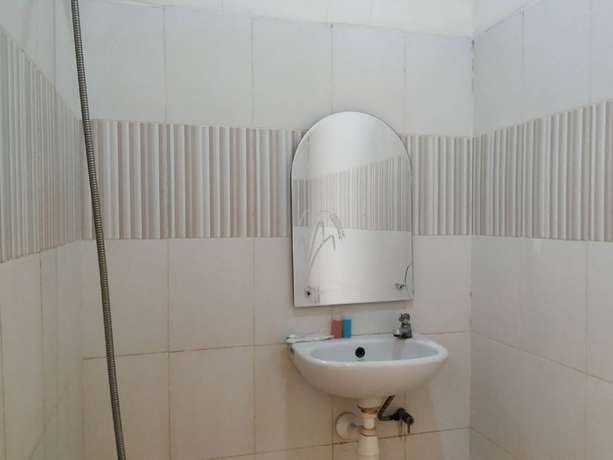 Imagen de la habitación del Hotel OYO 2293 Lulu Homestay. Foto 8