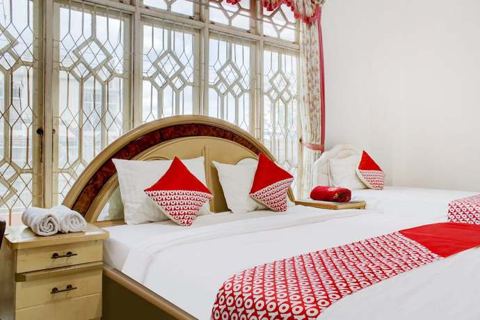 Imagen de la habitación del Hotel OYO 2301 Hocky Guest House. Foto 2