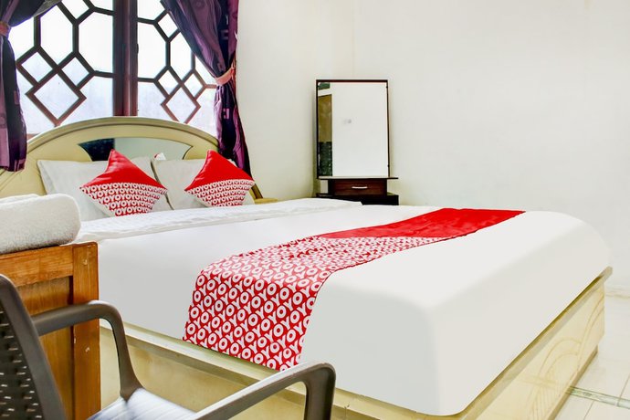 Imagen de la habitación del Hotel OYO 2301 Hocky Guest House. Foto 3