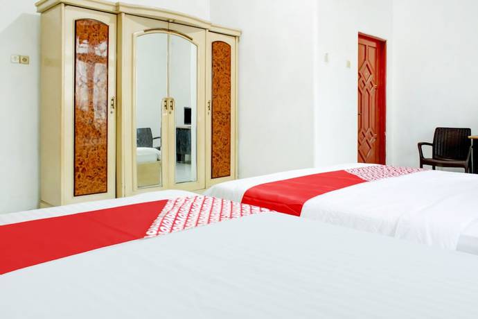 Imagen de la habitación del Hotel OYO 2301 Hocky Guest House. Foto 5