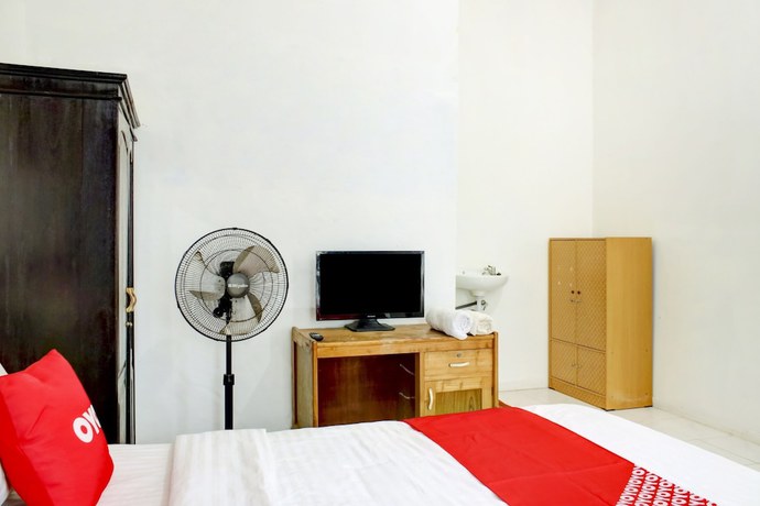 Imagen de la habitación del Hotel OYO 2301 Hocky Guest House. Foto 7