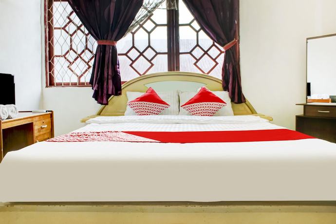 Imagen de la habitación del Hotel OYO 2301 Hocky Guest House. Foto 8