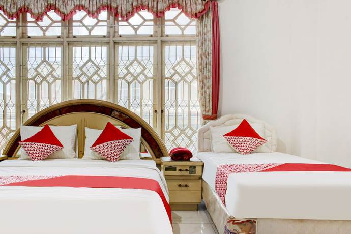 Imagen de la habitación del Hotel OYO 2301 Hocky Guest House. Foto 9