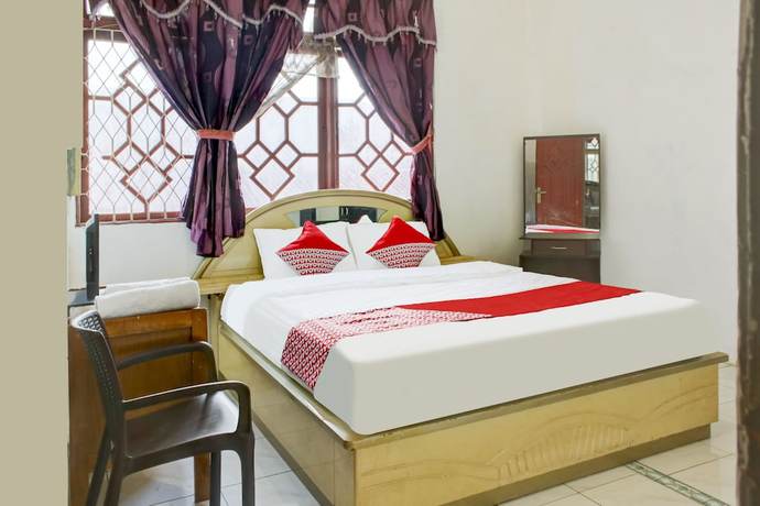 Imagen de la habitación del Hotel OYO 2301 Hocky Guest House. Foto 11