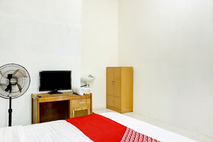 Imagen de la habitación del Hotel OYO 2301 Hocky Guest House. Foto 13