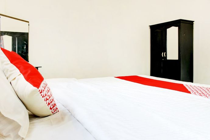 Imagen de la habitación del Hotel OYO 2301 Hocky Guest House. Foto 14