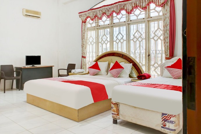 Imagen de la habitación del Hotel OYO 2301 Hocky Guest House. Foto 15