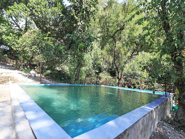 Imagen de la piscina del Hotel OYO 23439 Tapovan Heights Camp and Resort. Foto 19