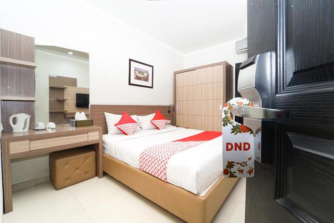 Imagen de la habitación del Hotel OYO 235 Maumu Hotel Lounge. Foto 7