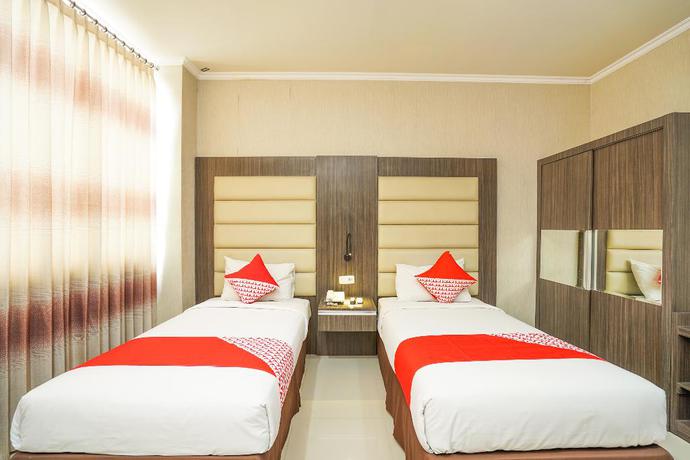 Imagen de la habitación del Hotel OYO 235 Maumu Hotel Lounge. Foto 10