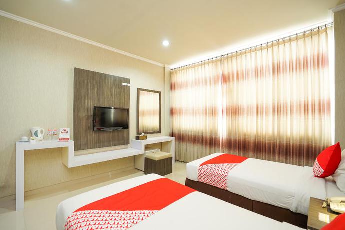 Imagen de la habitación del Hotel OYO 235 Maumu Hotel Lounge. Foto 12