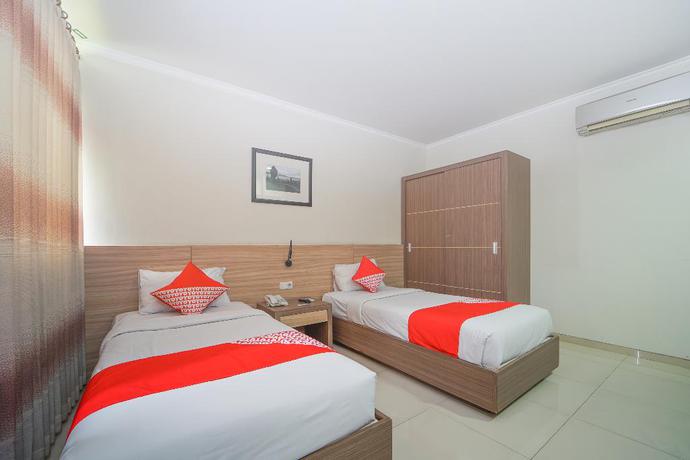 Imagen de la habitación del Hotel OYO 235 Maumu Hotel Lounge. Foto 15