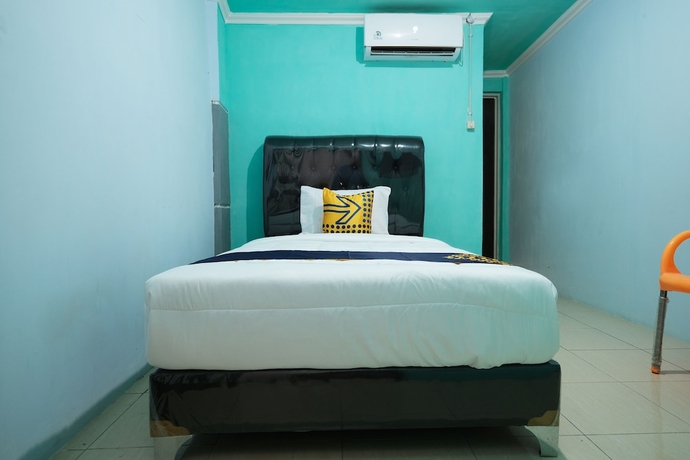 Imagen de la habitación del Hotel OYO 2389 Kostel 99. Foto 7