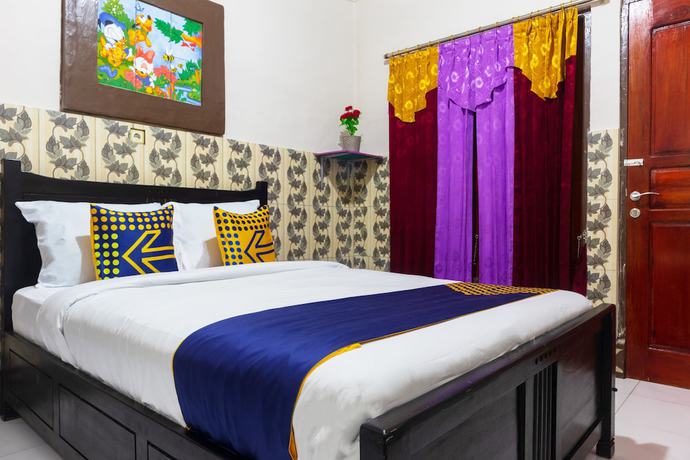 Imagen de la habitación del Hotel OYO 2518 Wilma Ii Premier. Foto 8