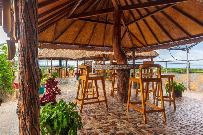 Imagen del bar/restaurante del Hotel OYO 2518 Wilma Ii Premier. Foto 6