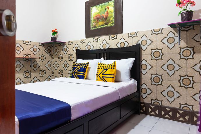 Imagen de la habitación del Hotel OYO 2518 Wilma Ii Premier. Foto 10