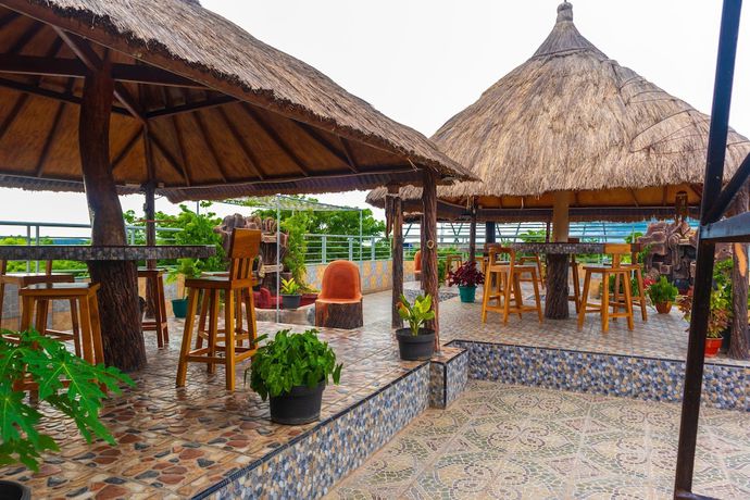 Imagen del bar/restaurante del Hotel OYO 2518 Wilma Ii Premier. Foto 7