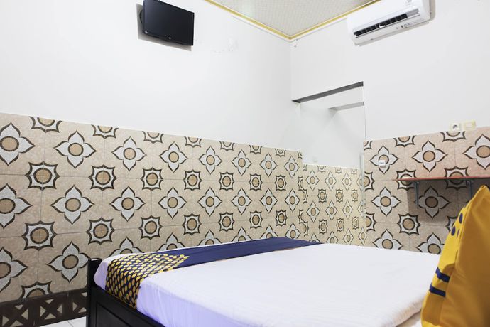 Imagen de la habitación del Hotel OYO 2518 Wilma Ii Premier. Foto 12