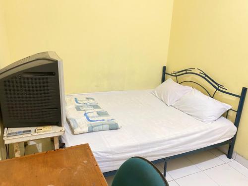 Imagen de la habitación del Hotel OYO 2628 Kartini Residence, Pasar Baru. Foto 9