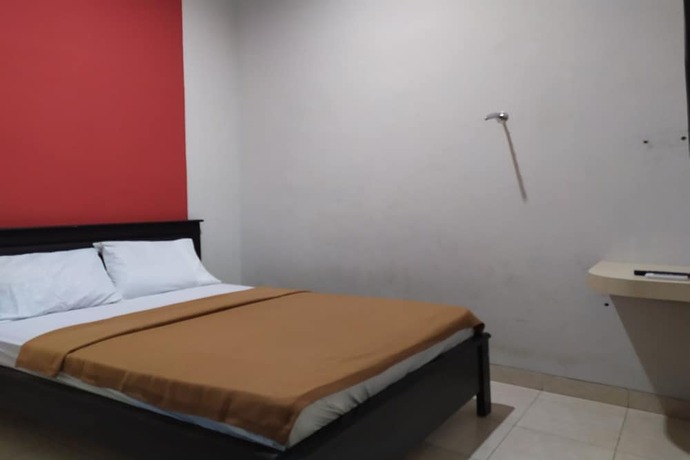 Imagen de la habitación del Hotel OYO 2654 Yulia Guesthouse. Foto 17