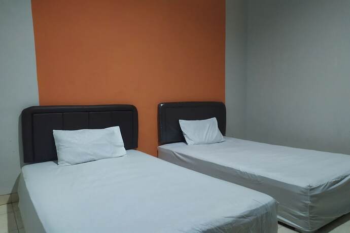 Imagen de la habitación del Hotel OYO 2654 Yulia Guesthouse. Foto 18