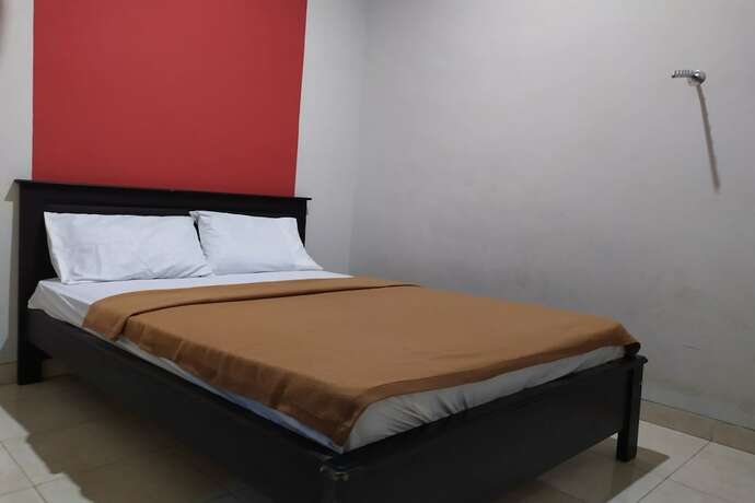Imagen de la habitación del Hotel OYO 2654 Yulia Guesthouse. Foto 19