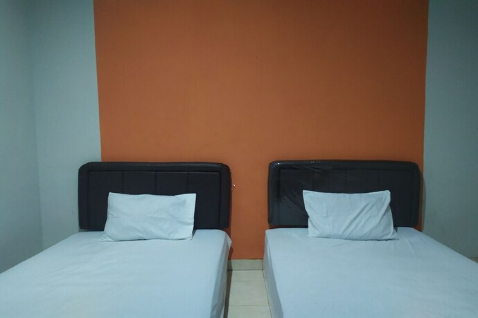 Imagen de la habitación del Hotel OYO 2654 Yulia Guesthouse. Foto 20