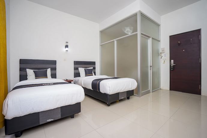 Imagen de la habitación del Hotel OYO 2695 D\'es Guest House. Foto 3