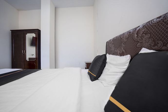 Imagen de la habitación del Hotel OYO 2695 D\'es Guest House. Foto 4