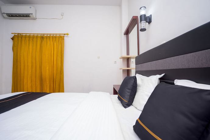Imagen de la habitación del Hotel OYO 2695 D\'es Guest House. Foto 6