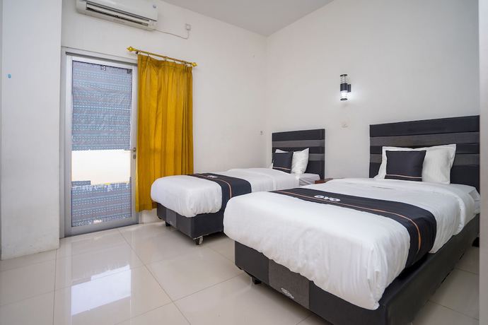 Imagen de la habitación del Hotel OYO 2695 D\'es Guest House. Foto 7