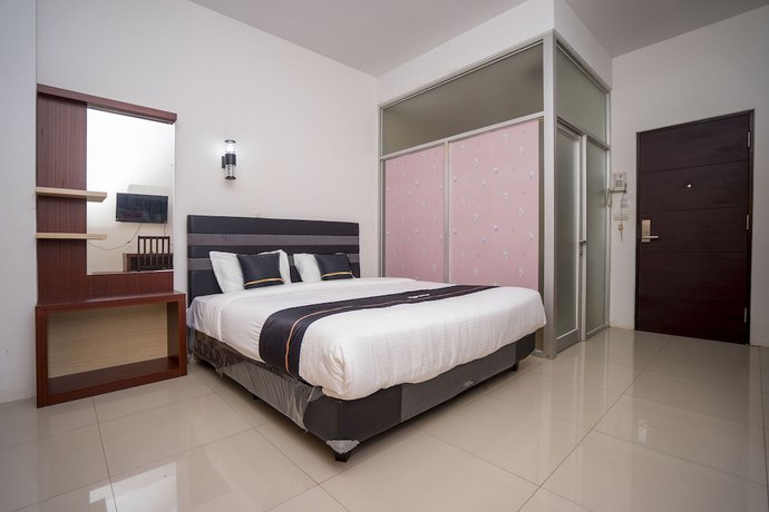 Imagen de la habitación del Hotel OYO 2695 D\'es Guest House. Foto 8